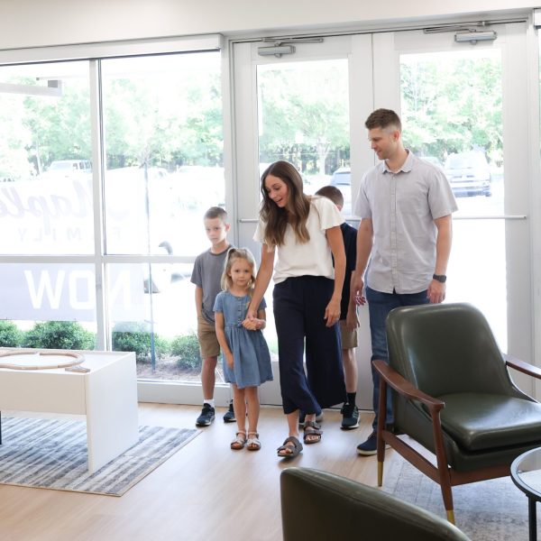 young family arriving in the office